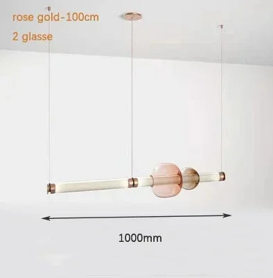 Lámpara colgante de cristal minimalista con detalles de latón