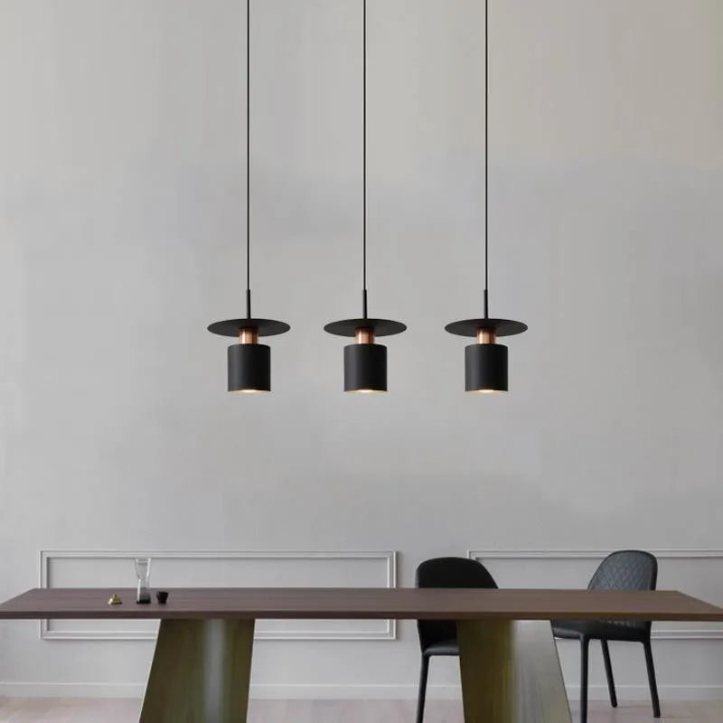 Modern Black Disc and Cylinder Pendant Light with Copper Glow for Bedside