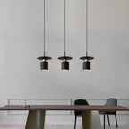 Modern Black Disc and Cylinder Pendant Light with Copper Glow for Bedside